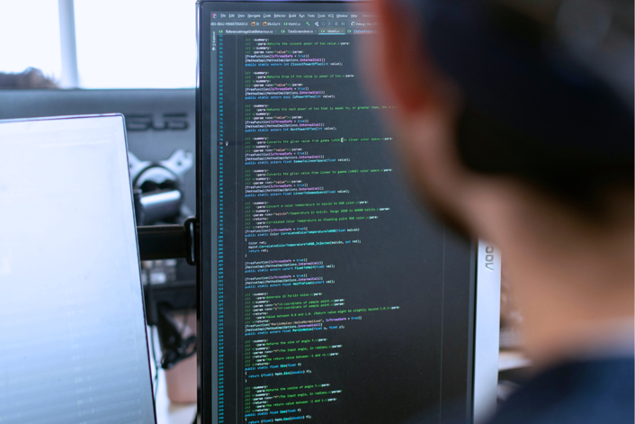 Developer optimising backend system scalability - Hover